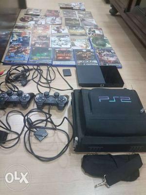 Playstation 2 PS2 with 25+ games, 2 remote