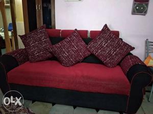 Red And Black Fabric Sofa With Throw Pillows