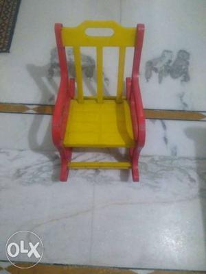 Red And Yellow Plastic Rocking Chair