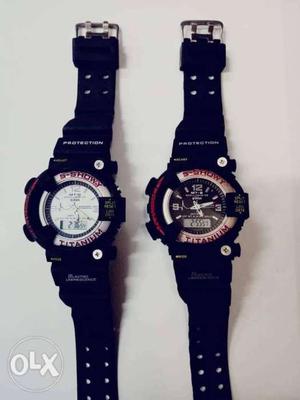 Two Black And Blue Digital Watches