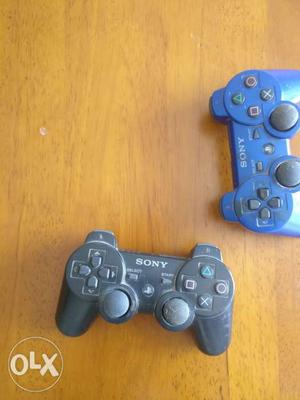 Two PlayStation 3 Dual Shock Controllers