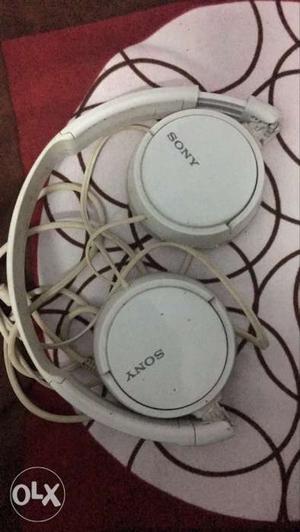 Two White And Gray Sony Corded Headphones