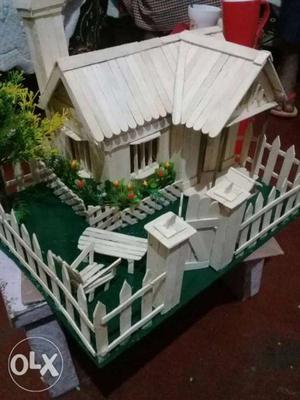 White And Green Wooden House