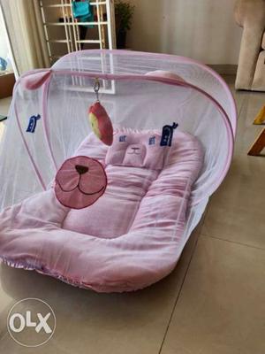 Brand new, portable baby bed with attached
