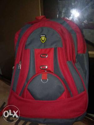 New unused red grey bagpack