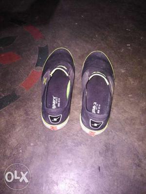 Pair Of Black Vans Slip-on Shoes