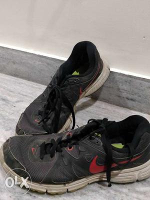 Pair Of Black-and-pink Nike Running Shoes