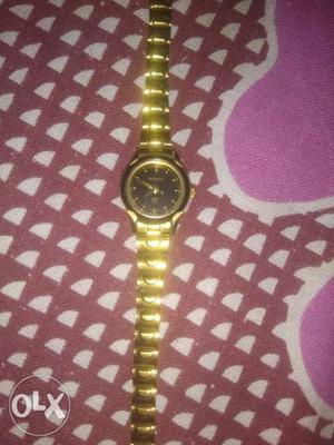 Sonata watch with gold colour at least price
