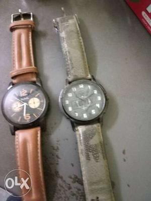 Two Round Silver Chronograph Watches With Brown Leather