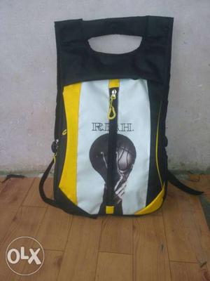 White, Yellow, And Black Backpack