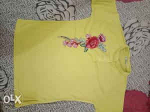Yellow embroidered top of size M i.e., 36