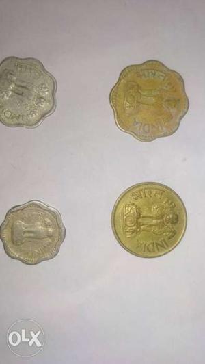 Four Silver-and-gold-colored Coins