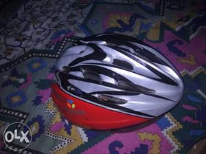 Red And White bicycle helmet