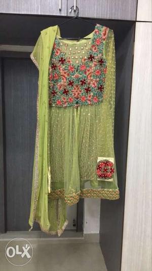 A beautiful green dress comes with a dupatta,