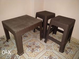 A set of fiber plastic table with 2 stools in