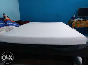 Almost new mattress with mattress protector and foldable bed
