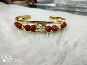 Gold-colored And Red Gemstone Ring