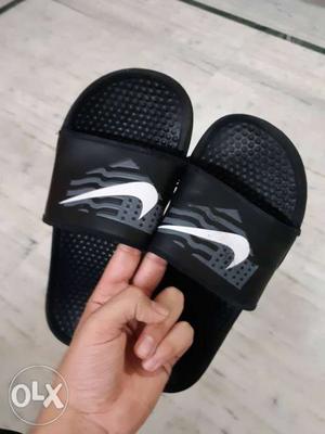 Pair Of Black Nike slippers With Box