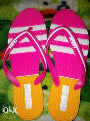 Pair Of Pink-and-white Flip Flops size .