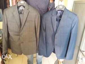 Two branded suits with blazzer and trousers