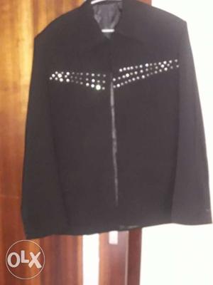 A black coat with stones... size 40 enhance your