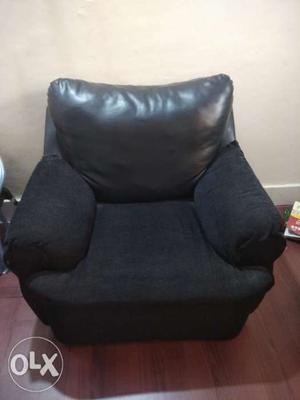 Black Fabric Sofa Chair With Throw Pillow