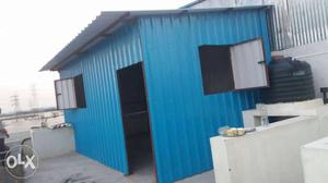 Blue And Black Wooden Shed