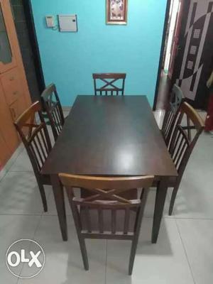 Brown wooden dining table six seater