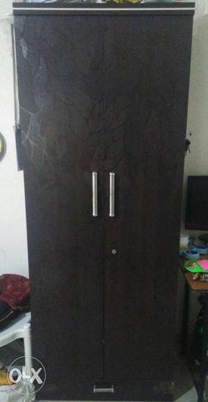 Dark brown double door wooden wardrobe