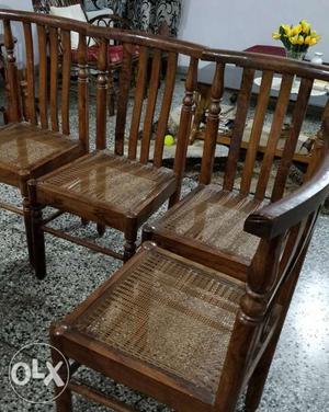 Four wooden dining chairs with 6 feet oval dining