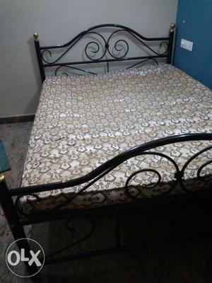Queen size rod iron bed with local mattress