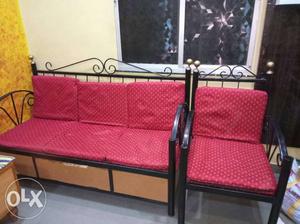 Red And Black Metal Frame Swing Bench