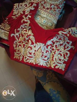 Red And golden heavy bridal lehnga