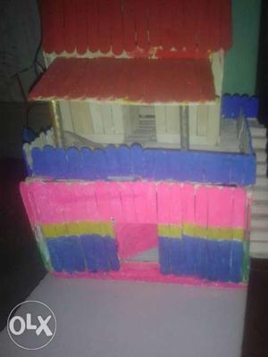 Red, Blue, And Yellow Plastic Dollhouse
