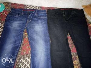 Three Blue And Black Denim Jeans