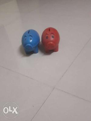 Two Blue And Orange Plastic Toys
