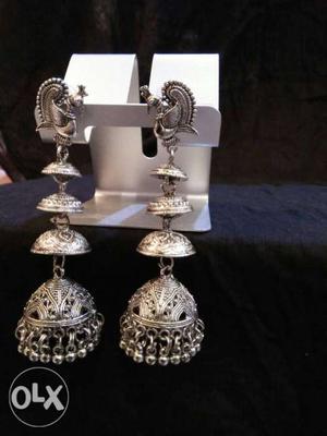 Two Silver-colored Candle Holders