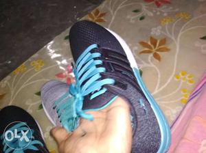 Unpaired Blue And Black Adidas Running Shoe