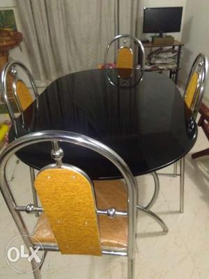 Used Dining table with four chairs one year old