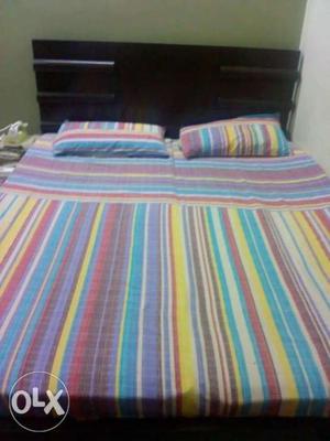 White, Blue, And Red Striped Bed Sheet