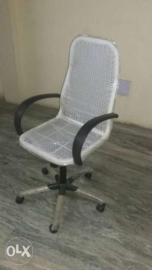 Wire netted revolving tilting high back chair for