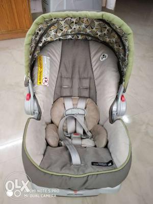 Baby's Gray And Green Car Seat Carrier