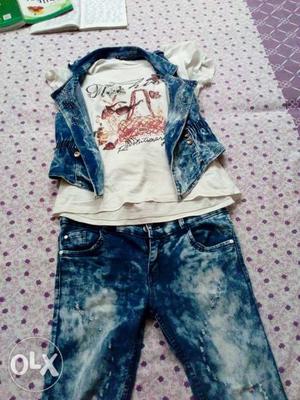 It is a jeans top with upper jacket of top and it's size is