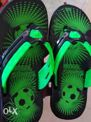 Pair Of Green-and-black Nike Flip Flops