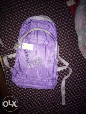Purple And White Backpack With Pack