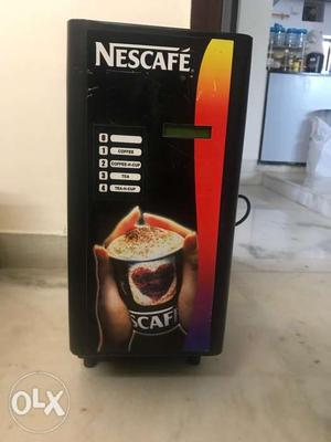 Black And Red Nescafe Coffee machine