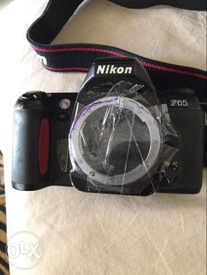 Nikon F65 SLR canera body without lens.. uses Film
