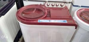 Red And White Front-load Clothes Washer
