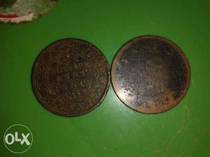 Two Round Black And Brown Plates