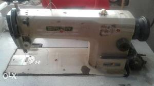 White And Gray Electric Sewing Machine